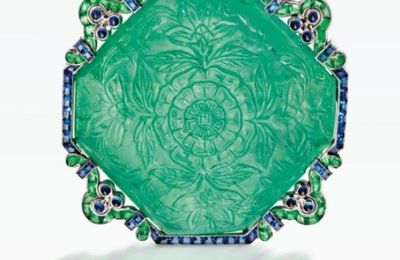 A very rare platinum, carved emerald, emerald and sapphire brooch, Cartier, New York, circa 1920