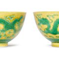 A pair of yellow-ground green-enamelled ‘Dragon and Phoenix’ bowls, Guangxu six-character marks and of the period (1875-1908)