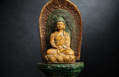 A sancai-glazed pottery figure of seated Buddha on a throne, Wanli period, dated by inscription 1584