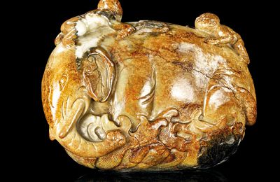 A rare beige and russet jade 'elephant and boys' group, China, circa 17th century