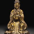 A small gilt-bronze figure of a seated Daoist immortal, Ming dynasty (1368-1644)