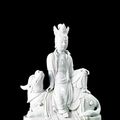 A Blanc de Chine porcelain figure of Simhanada Avalokitesvara and qilin, China, Qing dynasty, 19th century 