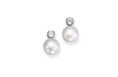 A pair of important natural pearl and diamond earclips