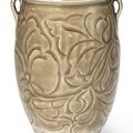 A rare carved Yaozhou celadon 'floral' jar, Northern Song dynasty (960-1127)