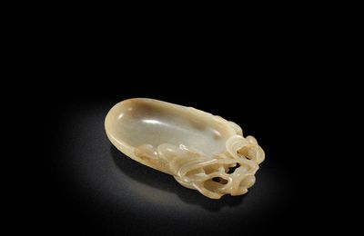 A pale green jade 'lychee' brush washer, 17th century