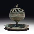 A bronze pedestal censer and openwork cover, Han dynasty (206 BC - AD 220)