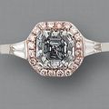 A fancy deep blue diamond and diamond ring