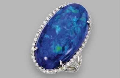 25.69 carats oval cabochon opal and diamond ring