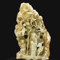 A large celadon and russet jade ‘Longevity’ mountain, Qing dynasty, 18th century