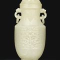 A pale green jade archaistic vase and cover, Qing dynasty, 18th-19th century