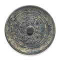 A bronze circular mirror with deities, animals and inscription, Late Eastern Han dynasty, 2nd-3rd century 