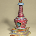 A ruby-red ground famille rose buddhist stupa, 18th-19th century