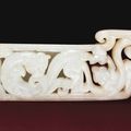 A very rare white jade openwork scabbard slide, Western Han dynasty (206 BC-AD 8)
