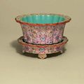 A pink-ground famille rose foliate jardinière and stand, Jiaqing six-character seal marks in iron red and of the period (1796-18