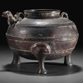 A copper-inlaid bronze ritual tripod wine vessel, he, Warring States period, 5th-4th century BC