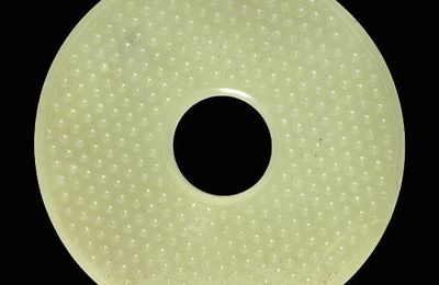 A rare pale grey jade disc, bi, Han dynasty, 2nd-1st century BC