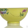 A famille rose 'scraffiato'-yellow-ground porcelain flower bowl, underglaze blue Qianlong seal mark and possibly of the period