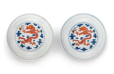 A pair of blue and white and iron-red 'dragon' dishes, Seal marks and period of Yongzheng (1723-1735)