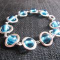 Bracelet perles bleues turquoises dans ovales argentés