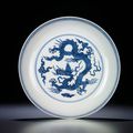 An extremely rare Ming blue and white 'dragon' dish, Hongzhi six-character mark within double-circles and of the period