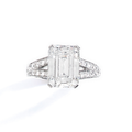 A diamond and platinum ring by Boucheron set with an emerald-cut diamond weighing 5,25 cts