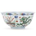 A wucai 'dragon and phoenix' bowl, Qianlong seal mark and of the period (1736-1795)