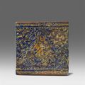An Iranian Lajvardina fritware tile with a hunting scene, 2nd half 13th century