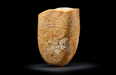 A pale green and russet jade archaistic rhyton cup, 18th century