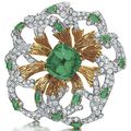An emerald, diamond and gold brooch, by David Webb