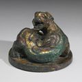 A gilt-bronze chilong-form weight, Han dynasty (206 BC-220 AD)