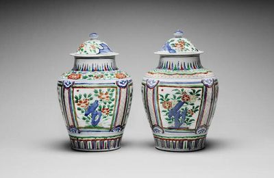 A pair of wucai baluster vases and covers, Circa 1660