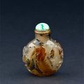 A well hollowed agate snuff bottle, carved with flowers and trees by rockwork. China, 1750-1860