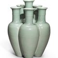 A rare celadon-glazed revolving six-necked vase (liukongping), Qianlong seal mark and period (1736-1795)