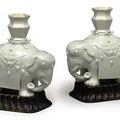 A pair of Blanc de Chine elephant candleholders, 17th-18th century