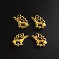 A set of four small Ordos gold stag plaques, 5th-3rd century BC