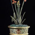 A fine gilt-bronze enamel planter with fine jade and stone leaves with fruit branches, China, Qianlong period 