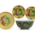 A green-ground aubergine-enamelled 'Dragon' bowl and three yellow-ground green and aubergine-enamelled dishes, Guangxu 