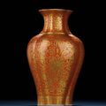 A coral-ground gilt-decorated quatrefoil vase, Jiaqing iron-red six-character sealmark and of the period (1796-1820)