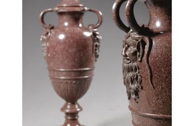 A large pair of Italian carved Egyptian porphyry vases and covers, late 18th/first half 19th century