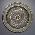 A bronze circular 'TLV' mirror, Xin dynasty (AD 9-24)