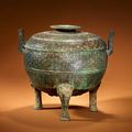 A rare large archaic bronze tripod vessel and cover, ding. Spring and Autumn Period