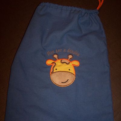 sac à doudou avec un appliqué girafe