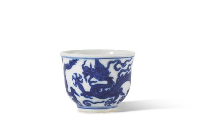 A rare small blue and white 'dragon' wine cup, Jiajing six-character mark and of the period (1522-1566)