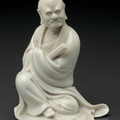 A small Dehua figure of a seated monk, China, Qing dynasty, 17th-18th century