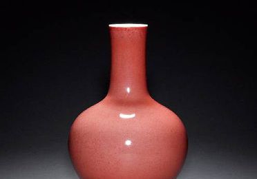 A sang-de-boeuf vase with cylindrical neck. Qianlong six-character mark