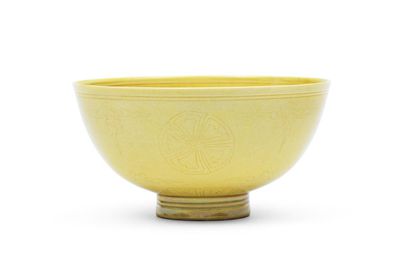 A rare yellow-glazed incised bowl, Kangxi six-character mark and of the period (1662-1722)