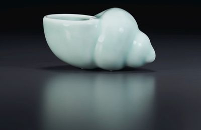 A rare celadon-glazed conch-form washer, Qianlong four-character seal mark in underglaze blue and of the period (1736-1795)