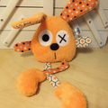 Doudou lapin orange étoilé