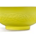 A rare and large molded lemon yellow-backed famille-rose 'peach' bowl, Yongzheng mark and period (1723-1735)