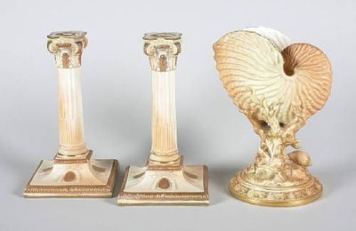 A pair of Royal Worcester Corinthian candlesticks and a Royal Worcester shell on coral. Dated 1891 and 1899.